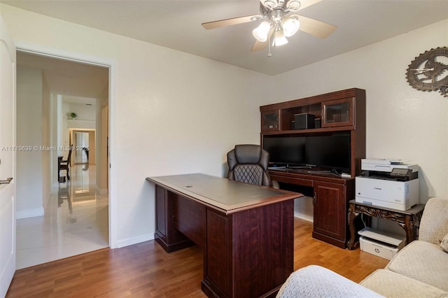 office area with ceiling fan and light hardwood / wood-style flooring