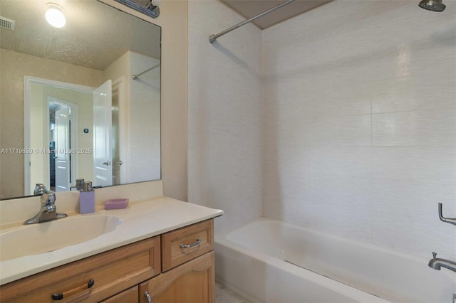 bathroom featuring shower / bathtub combination and vanity