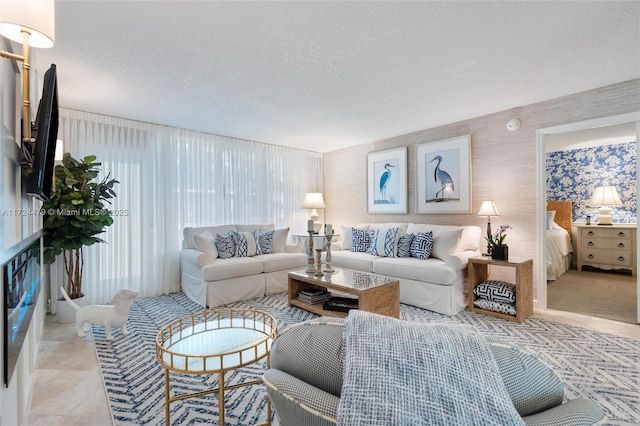 living room featuring light tile patterned floors and a textured ceiling