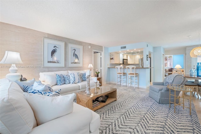 living room with a textured ceiling