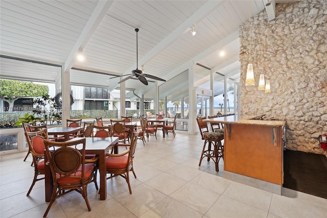 dining room featuring ceiling fan, light tile patterned floors, lofted ceiling with beams, and wooden ceiling