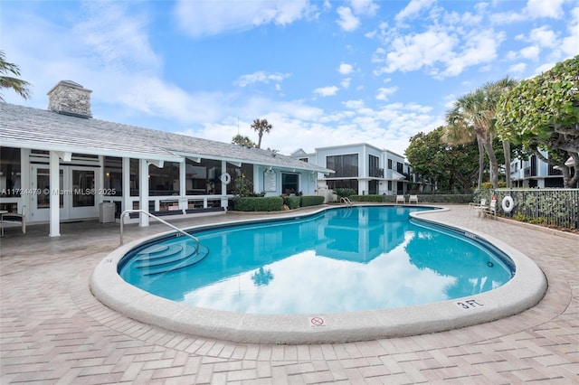 view of swimming pool with a patio area