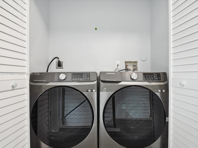 laundry room with independent washer and dryer