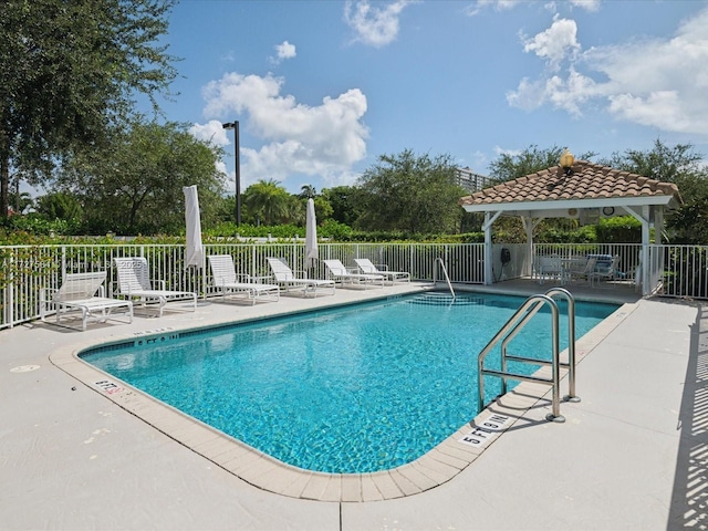 view of swimming pool with a gazebo and a patio