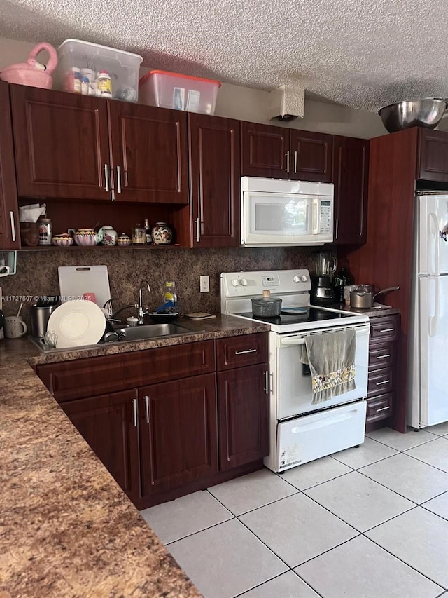 kitchen with backsplash, white appliances, light tile patterned flooring, a textured ceiling, and sink