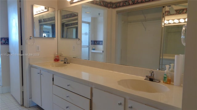 bathroom with vanity and tile patterned floors