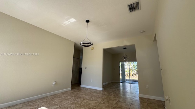 unfurnished room featuring tile patterned flooring