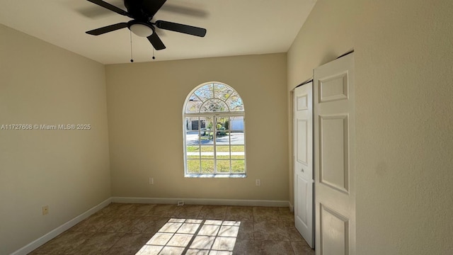 spare room with ceiling fan