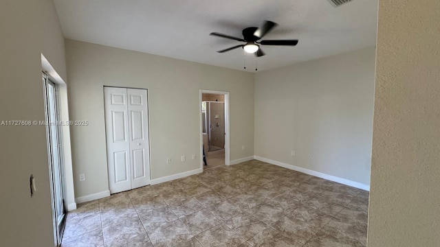 unfurnished bedroom with ensuite bath and ceiling fan