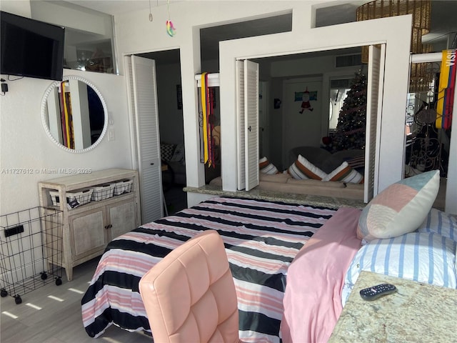 bedroom with a closet and light wood-type flooring