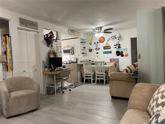 office area featuring ceiling fan and light hardwood / wood-style floors