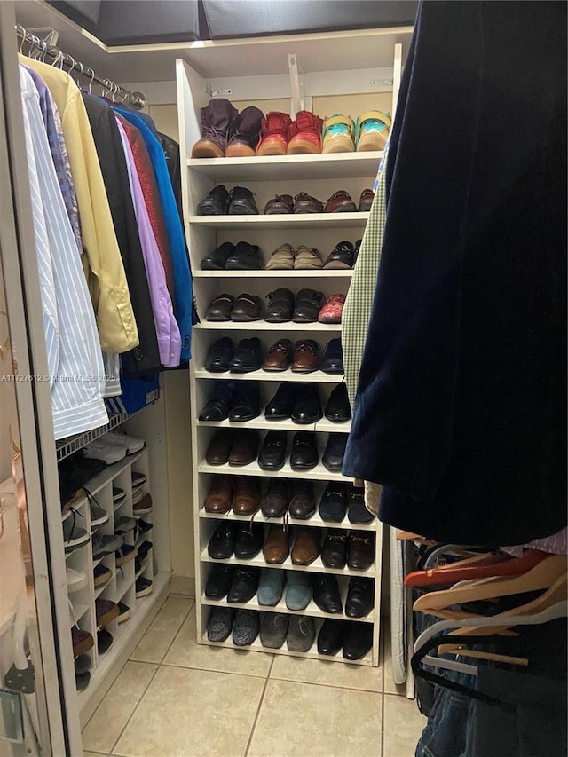 spacious closet with tile patterned floors