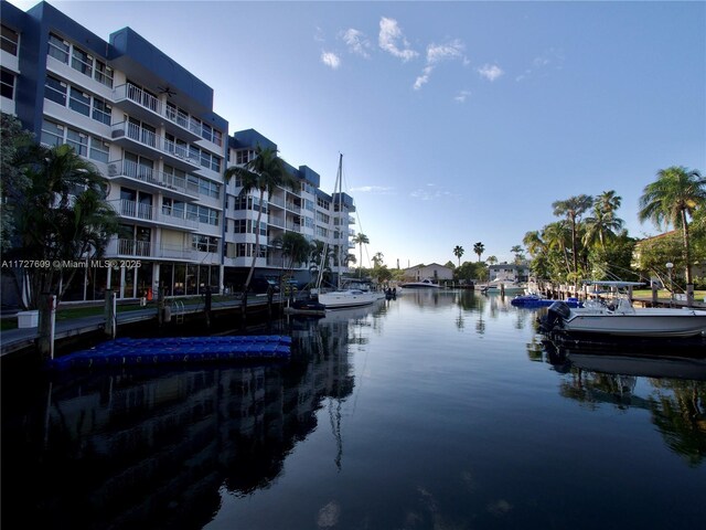 property view of water with a dock