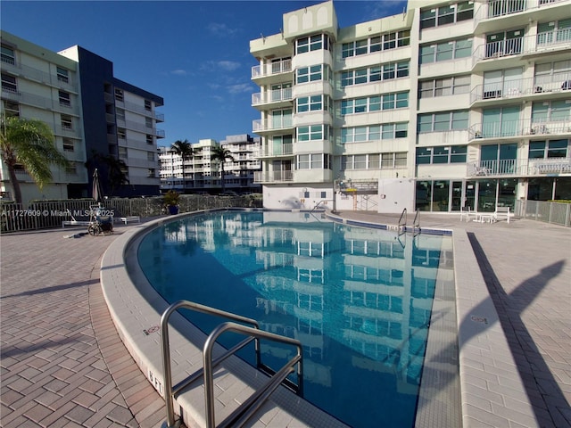 view of swimming pool featuring a view of city