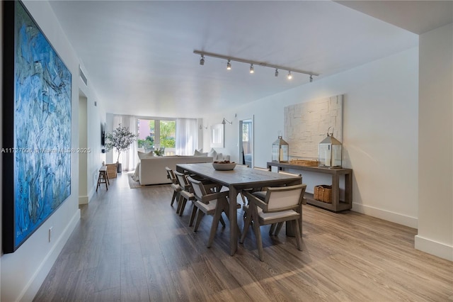 dining area featuring hardwood / wood-style floors