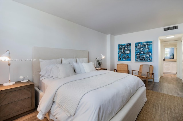 bedroom featuring wood-type flooring