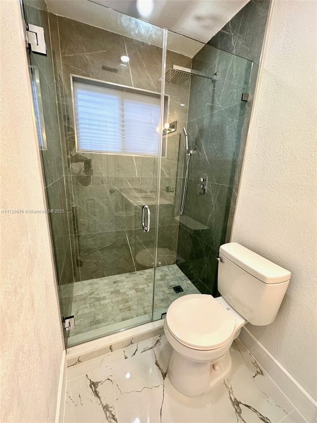 bathroom with toilet and walk in shower