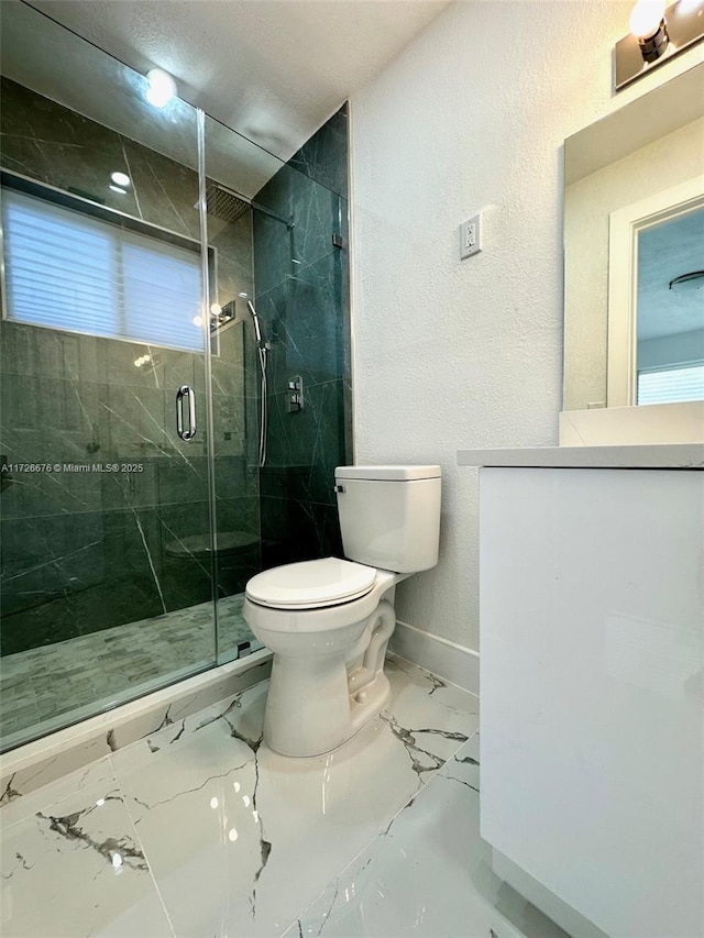 bathroom with toilet and an enclosed shower