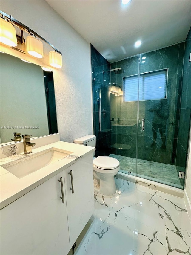 bathroom featuring an enclosed shower, vanity, and toilet