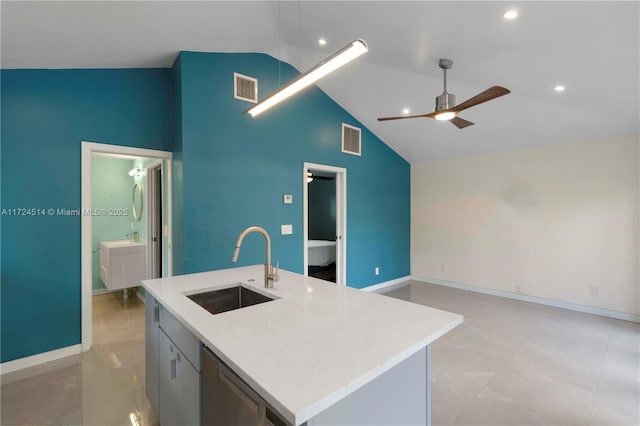 kitchen featuring sink, high vaulted ceiling, an island with sink, ceiling fan, and light stone countertops