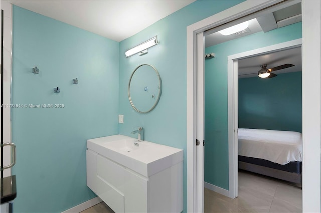 bathroom featuring ceiling fan, vanity, and tile patterned floors