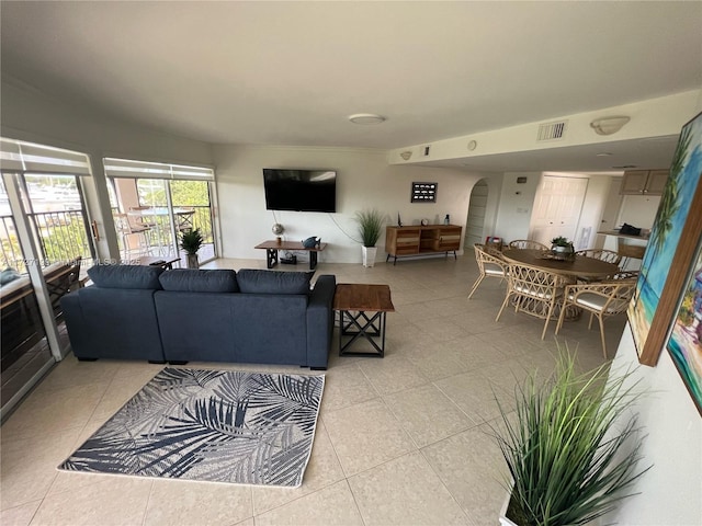 1998 Overseas Hwy Unit 33A, Marathon, FL 33050 - living room with arched walkways and light tile patterned flooring