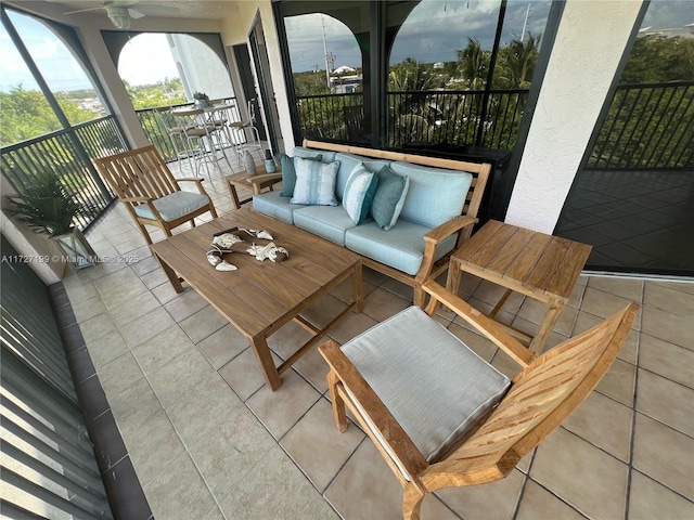 view of patio with an outdoor living space and ceiling fan