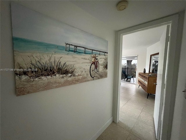 hallway with light tile patterned floors