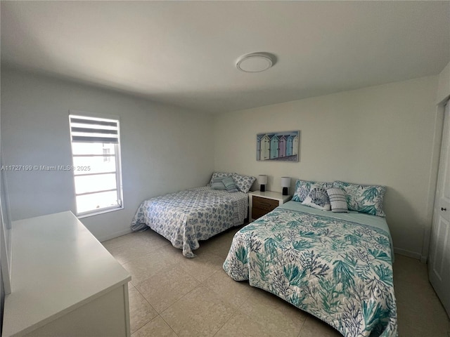 bedroom featuring baseboards