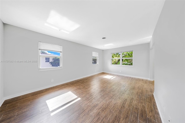 unfurnished room featuring dark hardwood / wood-style flooring