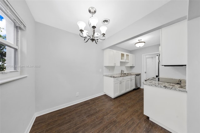 kitchen with backsplash, dishwasher, dark hardwood / wood-style floors, sink, and white cabinetry