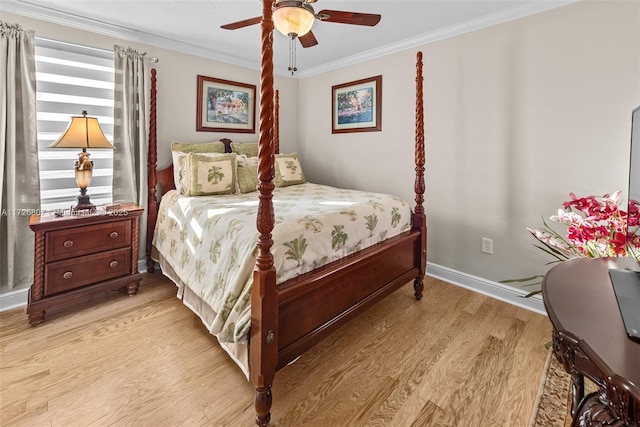 bedroom featuring baseboards, ceiling fan, ornamental molding, and light wood-style floors