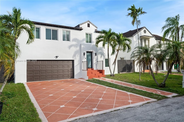 view of front of house with a garage and a front yard