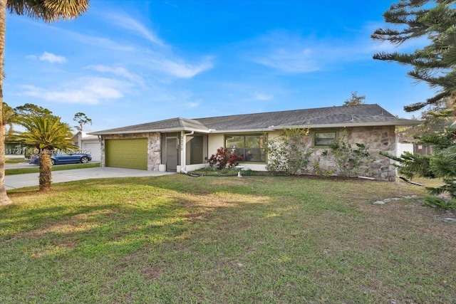 single story home featuring a front lawn and a garage