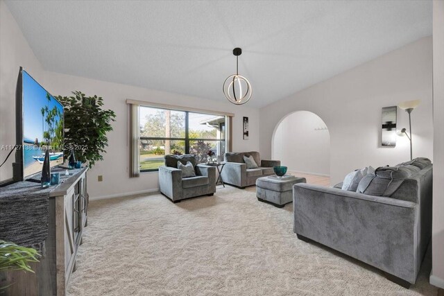 3270 Deer Lick, Kissimmee, FL 34746 - living room with lofted ceiling, a textured ceiling, and light colored carpet