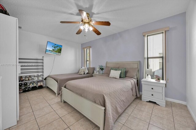 3270 Deer Lick, Kissimmee, FL 34746 - tiled bedroom with ceiling fan and a textured ceiling