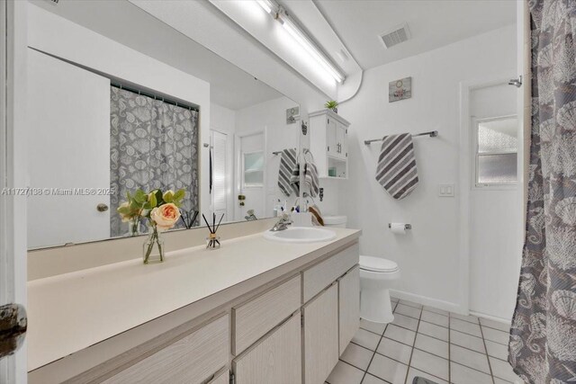 3270 Deer Lick, Kissimmee, FL 34746 - bathroom featuring tile patterned flooring, vanity, and toilet