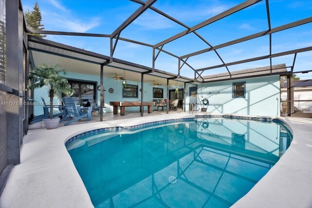3270 Deer Lick, Kissimmee, FL 34746 - view of swimming pool with ceiling fan, glass enclosure, and a patio