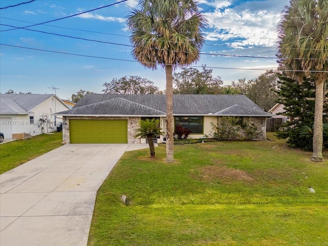 ranch-style home featuring a garage and a front yard