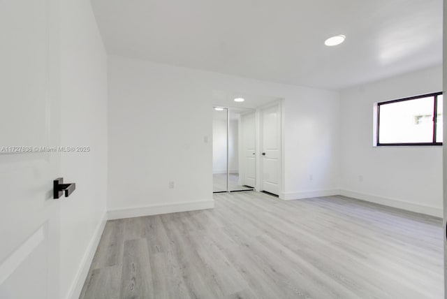 unfurnished room featuring light hardwood / wood-style flooring