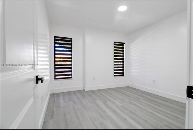 empty room with light wood-type flooring