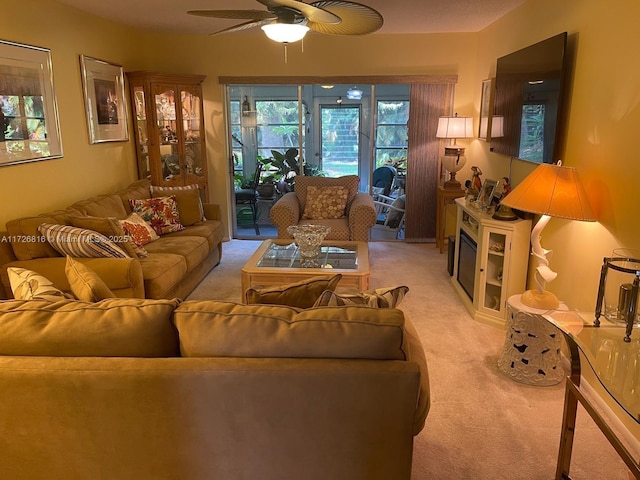 living room with ceiling fan and light carpet