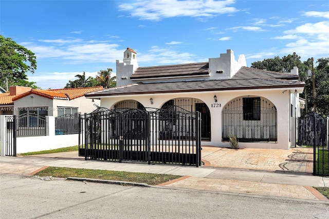 view of gate with a fenced front yard