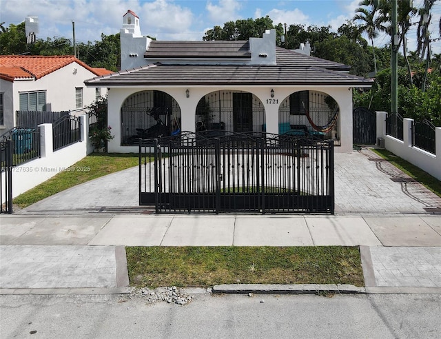 view of gate featuring a fenced front yard