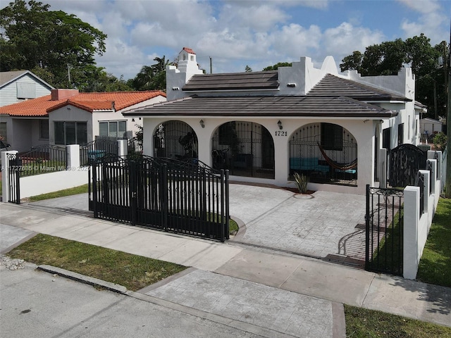 view of community with a fenced front yard and a gate