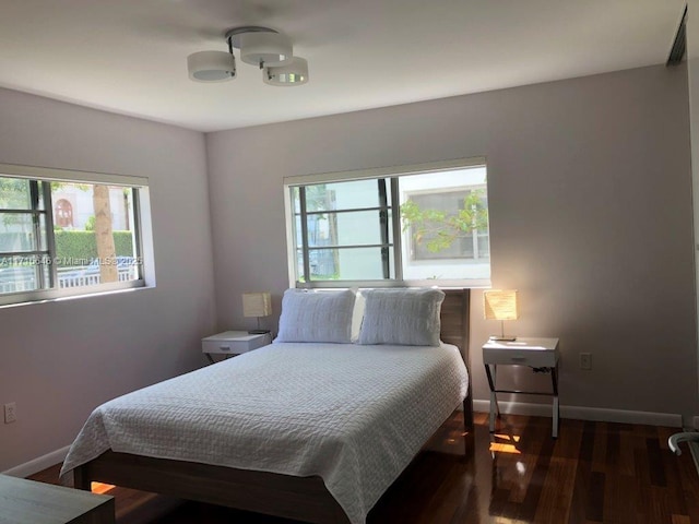 bedroom featuring dark hardwood / wood-style flooring