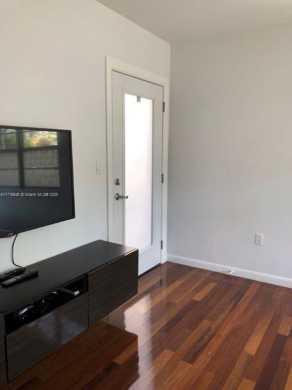 interior space with dark hardwood / wood-style flooring