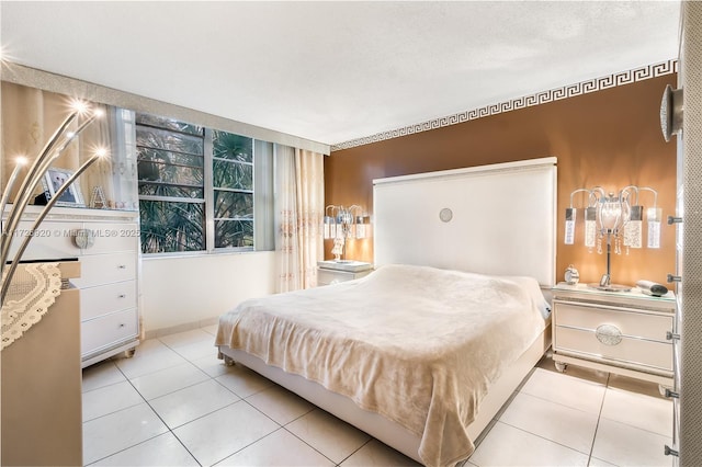 tiled bedroom featuring a textured ceiling