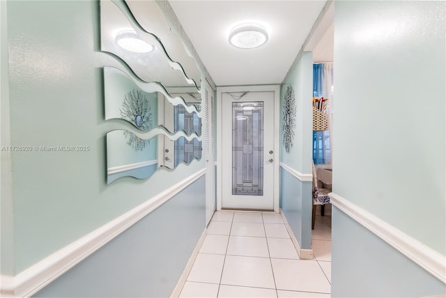 entryway with light tile patterned floors