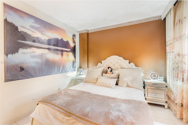 bedroom with light tile patterned floors